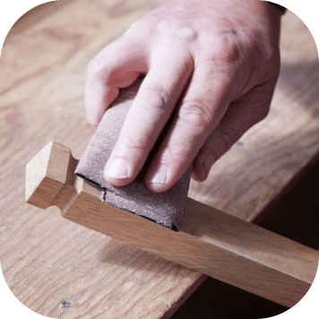 Hand sanding bespoke timber gate